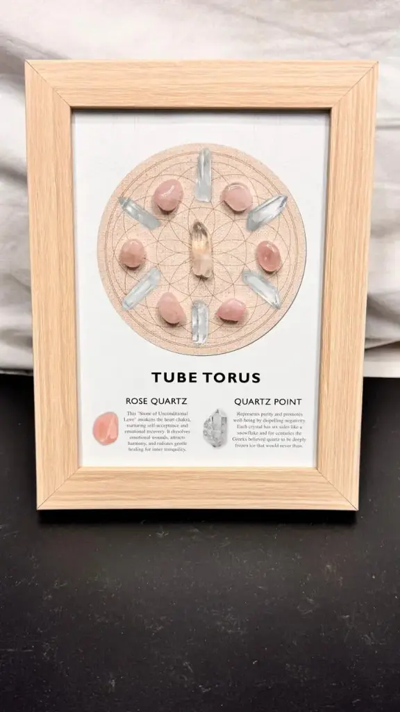 ✨ Tube Torus Crystal Grid Frame  Bring harmony and healing energy into your space with this beautifully crafted Tube Torus Crystal Grid. Featuring Rose Quartz for unconditional love and Clear Quartz Points for purity and energy amplification — this sacred geometry design symbolizes the infinite flow of universal energy.